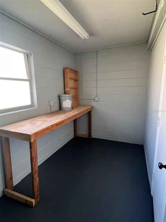 4317 Chipmunk Drive New Port Richey, FL 34653 - Photo 22 of 23 a room with a table chairs and a window