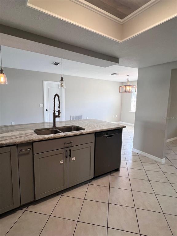 4317 Chipmunk Drive New Port Richey, FL 34653 - Photo 6 of 23 a kitchen with a sink a counter top space and appliances