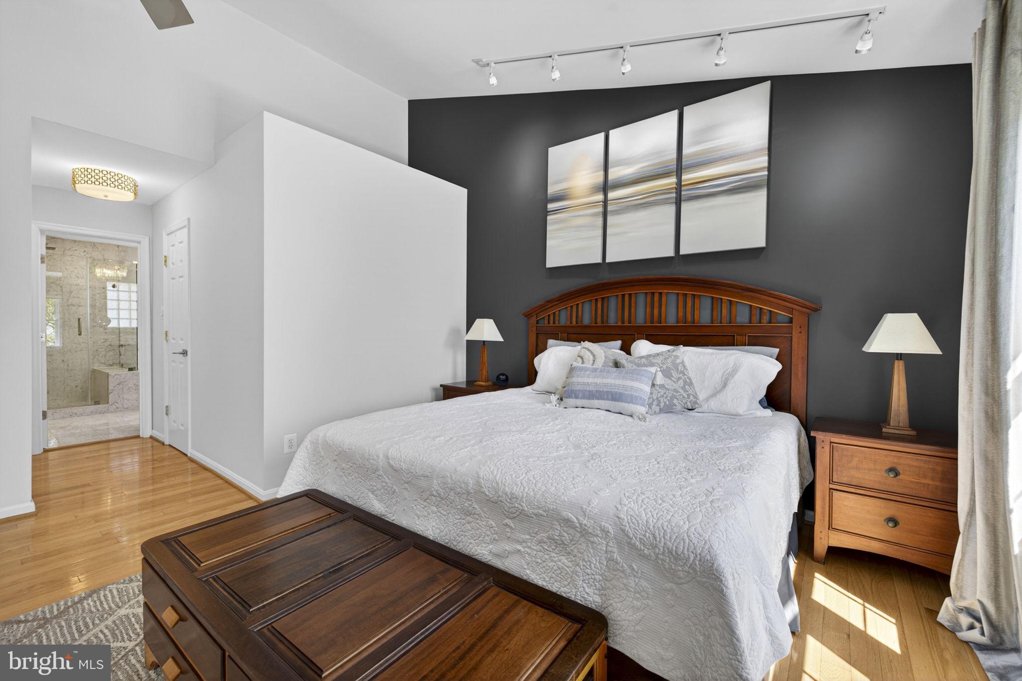 43200 Lighthouse Place Chantilly, VA 20152 - Photo 22 of 47 a bedroom with a bed and wooden floor