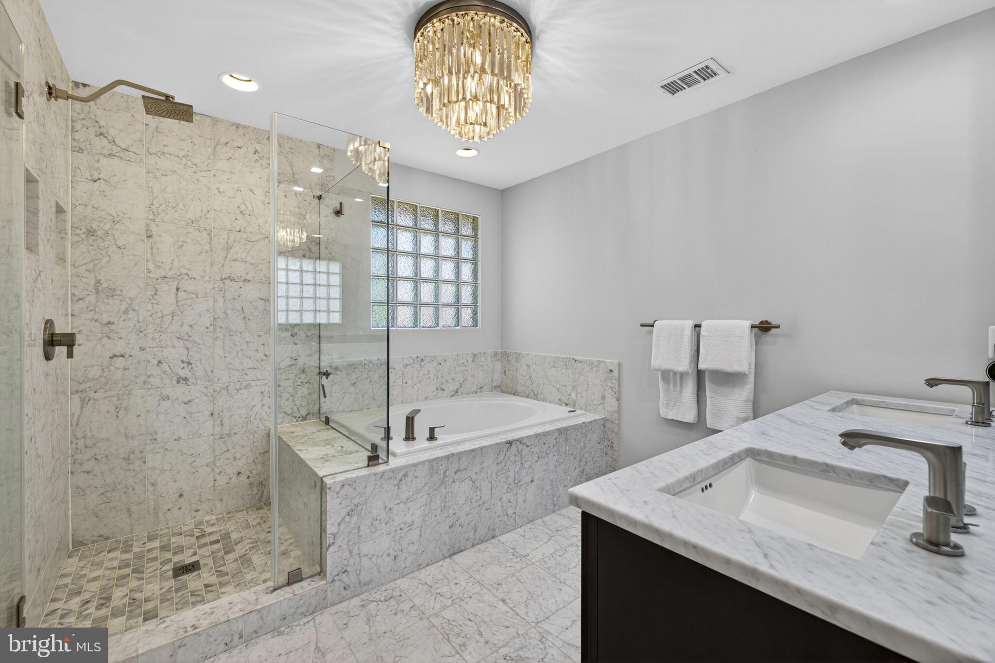 43200 Lighthouse Place Chantilly, VA 20152 - Photo 24 of 47 a bathroom with a tub sink and mirror