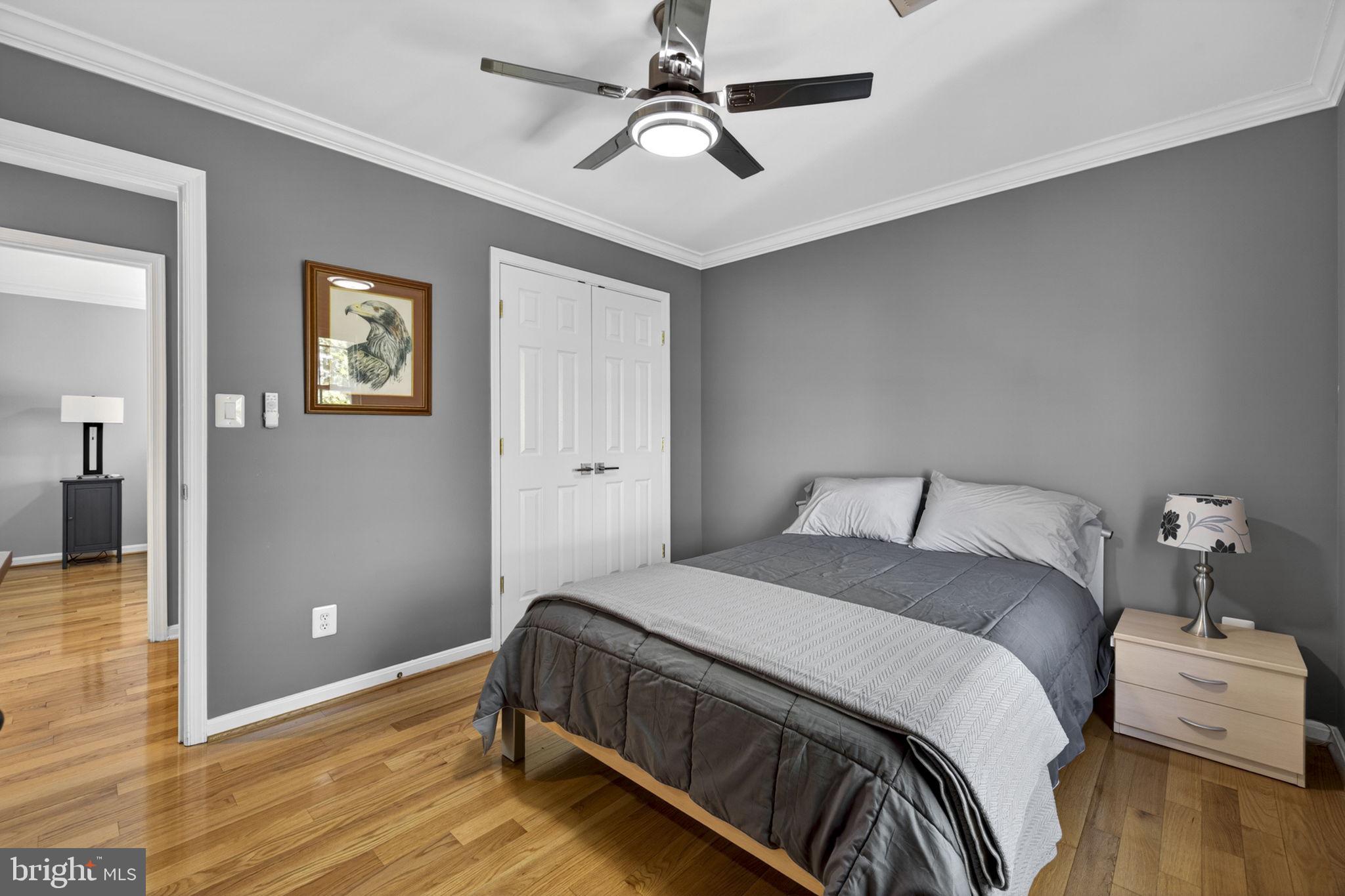 43200 Lighthouse Place Chantilly, VA 20152 - Photo 28 of 47 a bedroom with a bed and wooden floor