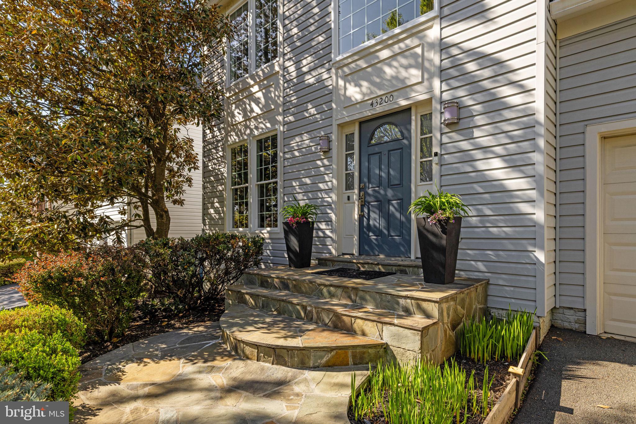 43200 Lighthouse Place Chantilly, VA 20152 - Photo 3 of 47 a view of a house with potted plants