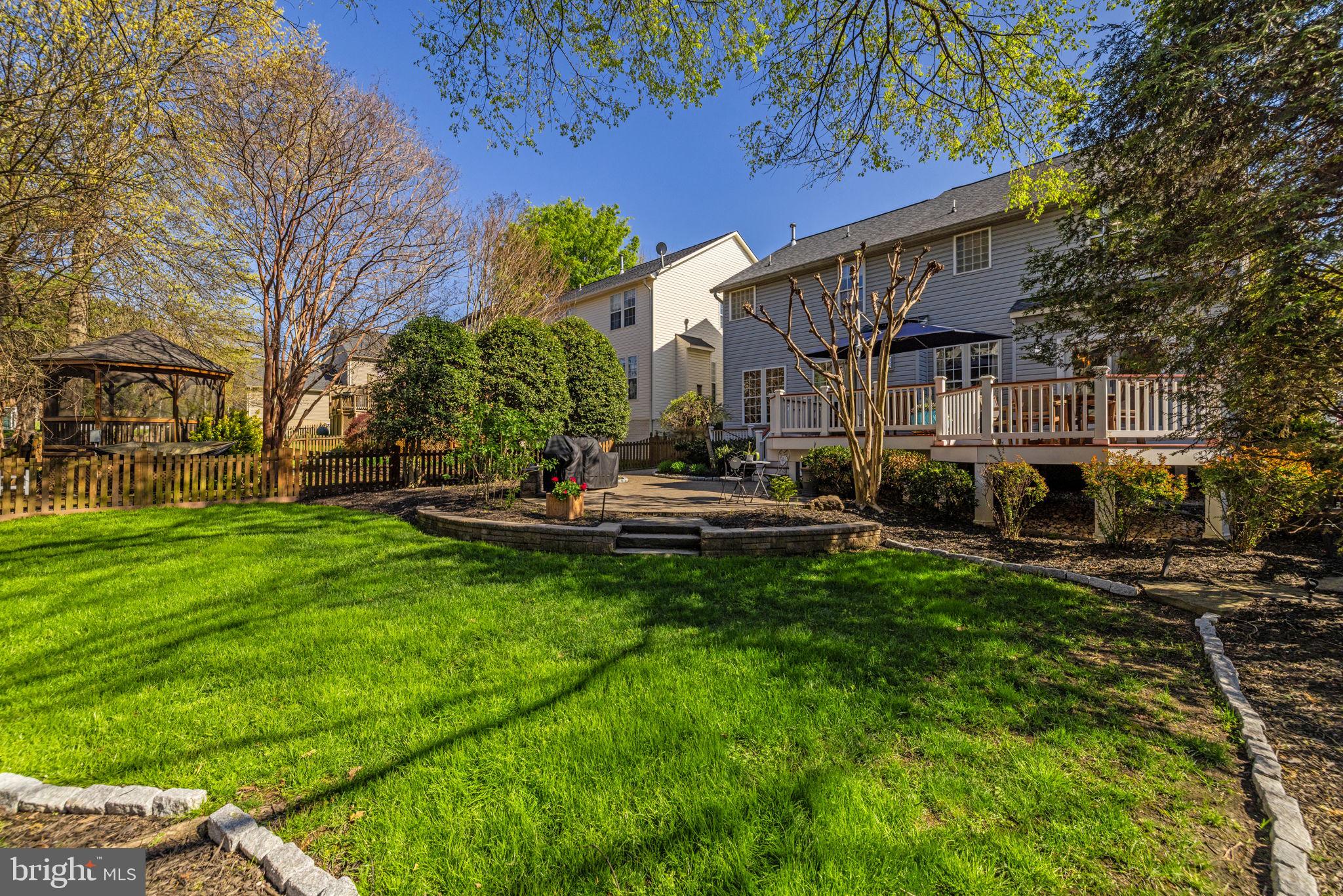 43200 Lighthouse Place Chantilly, VA 20152 - Photo 42 of 47 a view of a patio with couches plants and large trees