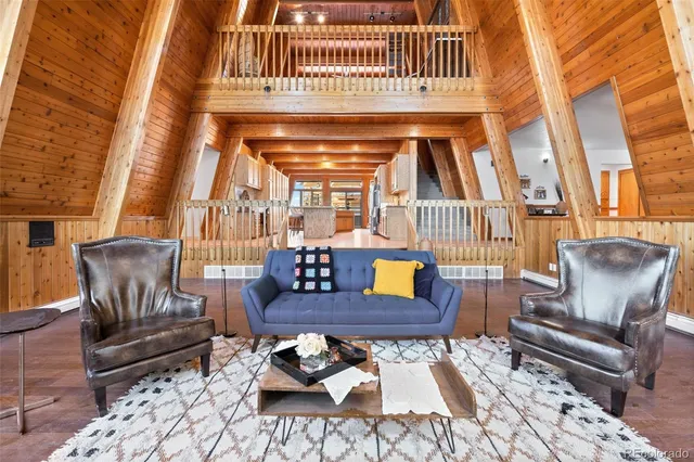 a living room with furniture and a rug