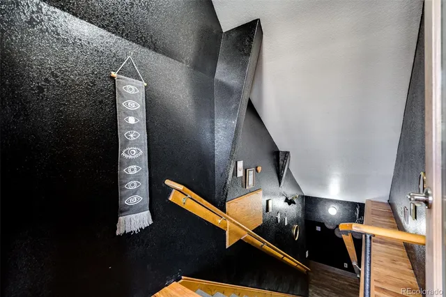 a view of an empty room with a kitchen