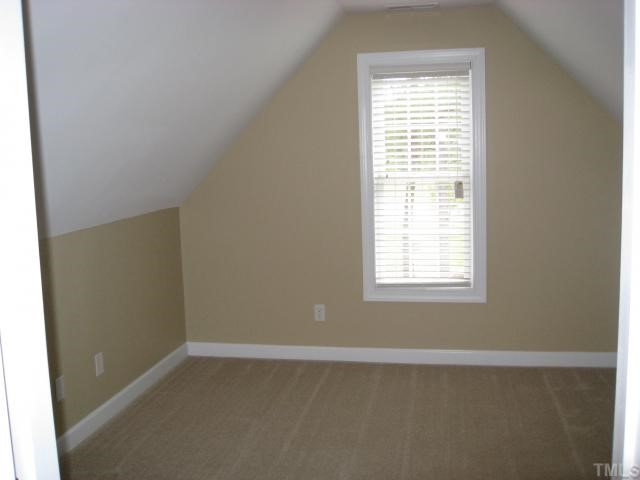 2912 Candlehurst Lane Raleigh, NC 27616 - Photo 11 of 12 an empty room with a window