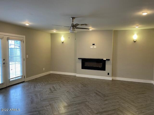 1416 East Del Rio Drive Tempe, AZ 85282 - Photo 15 of 27 an empty room with wooden floor and white walls