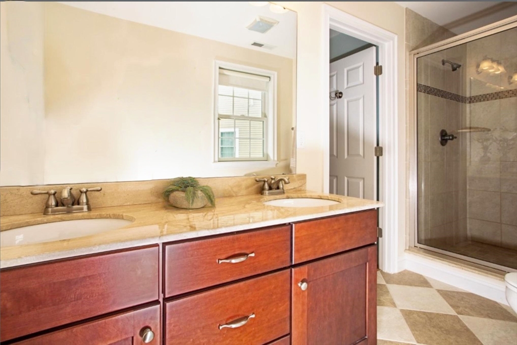 2 B Gates Lane, Unit B Wakefield, MA 01880 - Photo 42 of 42 a bathroom with a granite countertop sink and a mirror
