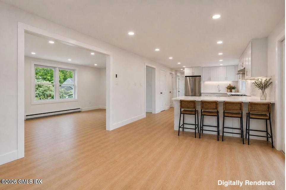 22 Carrona Drive Riverside, CT 06878 - Photo 6 of 26 a view of a kitchen with dining room and wooden floor
