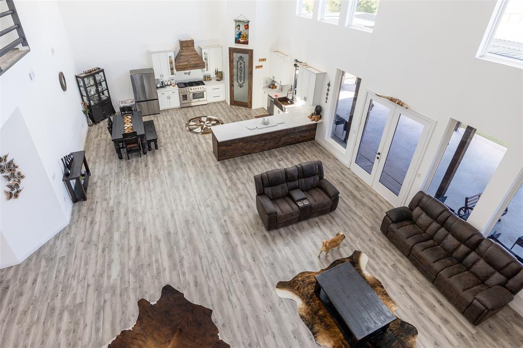 2630 Rockhill Road Aubrey, TX 76227 - Photo 35 of 36 a living room with furniture and wooden floor