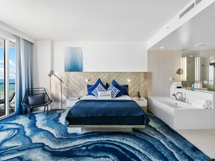 a spacious bedroom with a bed and window