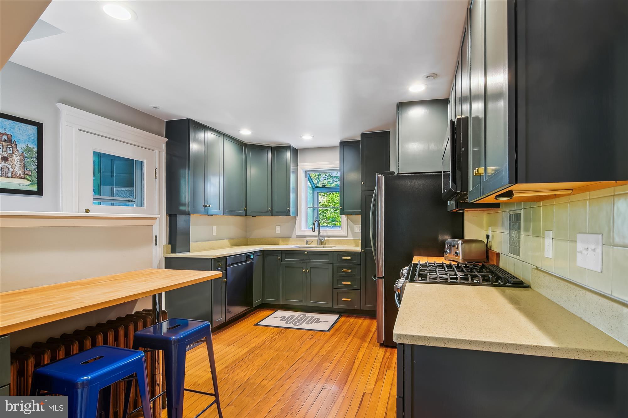 208 Edgevale Road Baltimore, MD 21210 - Photo 16 of 69 a kitchen with a sink cabinets and stainless steel appliances