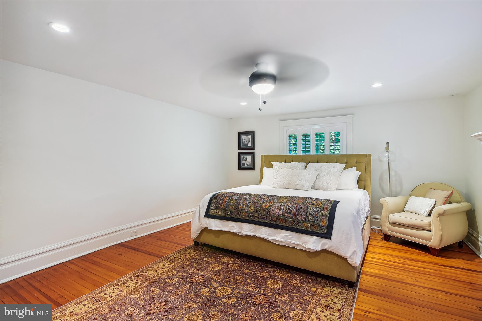 208 Edgevale Road Baltimore, MD 21210 - Photo 28 of 69 a spacious bedroom with a bed and wooden floor