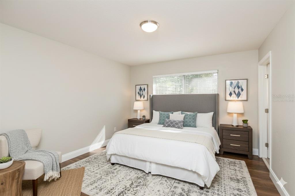 481 Ralwood Lane Northeast Palm Bay, FL 32907 - Photo 11 of 18 a bedroom with a bed and a couch