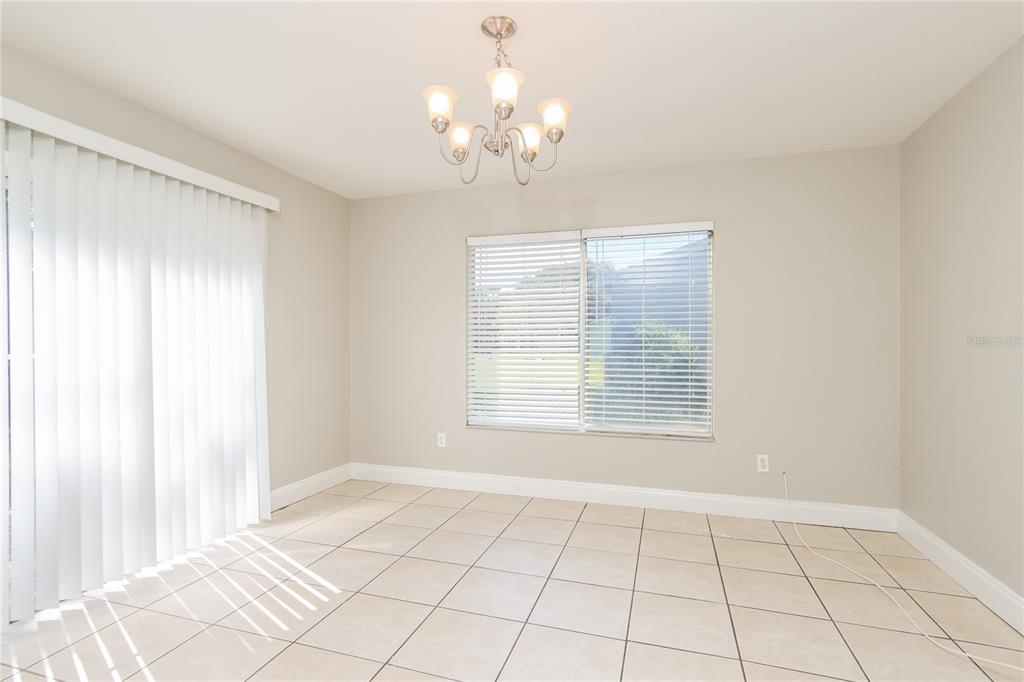 481 Ralwood Lane Northeast Palm Bay, FL 32907 - Photo 6 of 18 a view of an empty room with a window