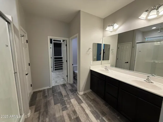 a bathroom with a double vanity sink a and mirror