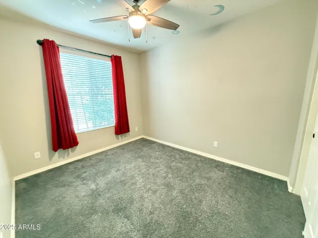 a view of a room with a projector and a fan