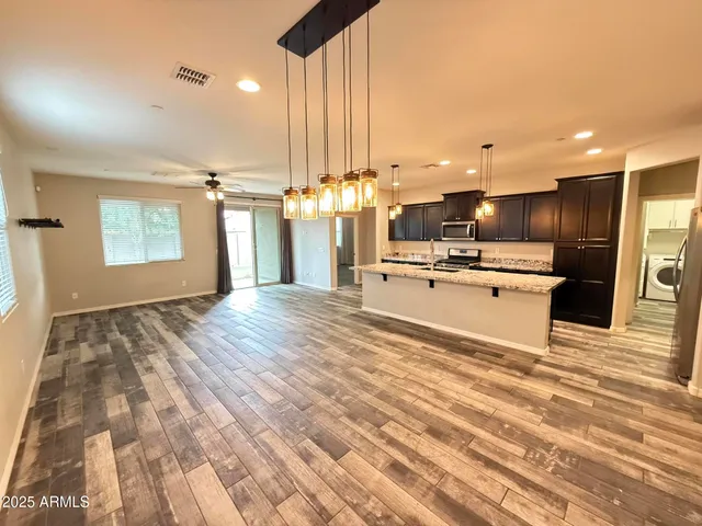 a view of kitchen and kitchen with sink