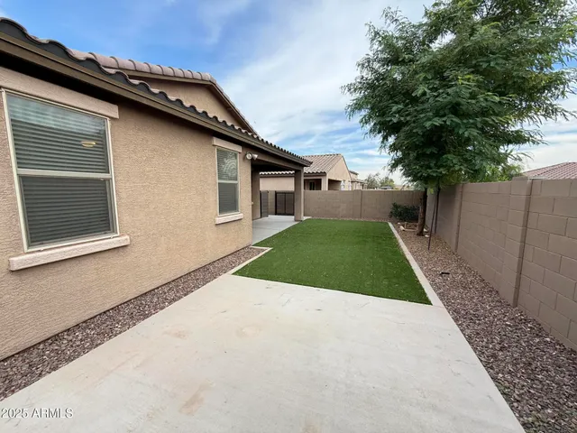 a view of a back yard of the house