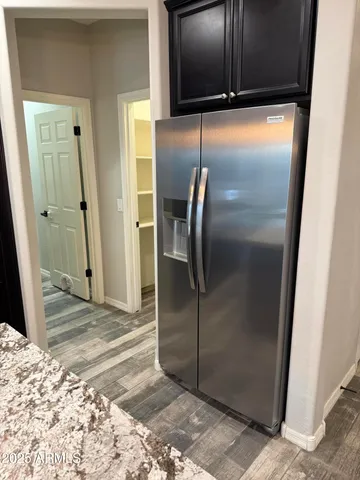 a bathroom with a refrigerator