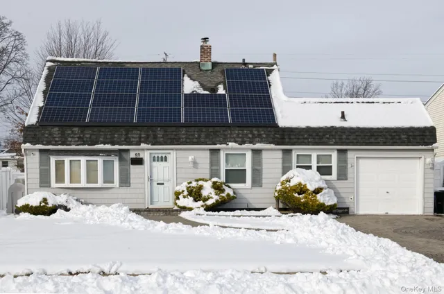 a front view of a building with barbeque outdoor space and balcony