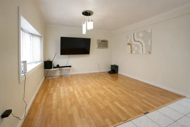 a kitchen with cabinets stainless steel appliances and a window