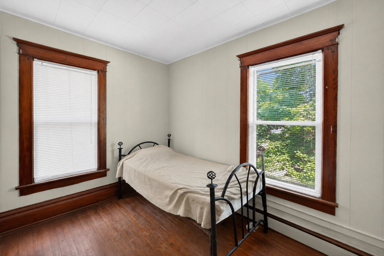 226 West Locust Street DeKalb, IL 60115 - Photo 17 of 40 a bedroom with a bed and a window