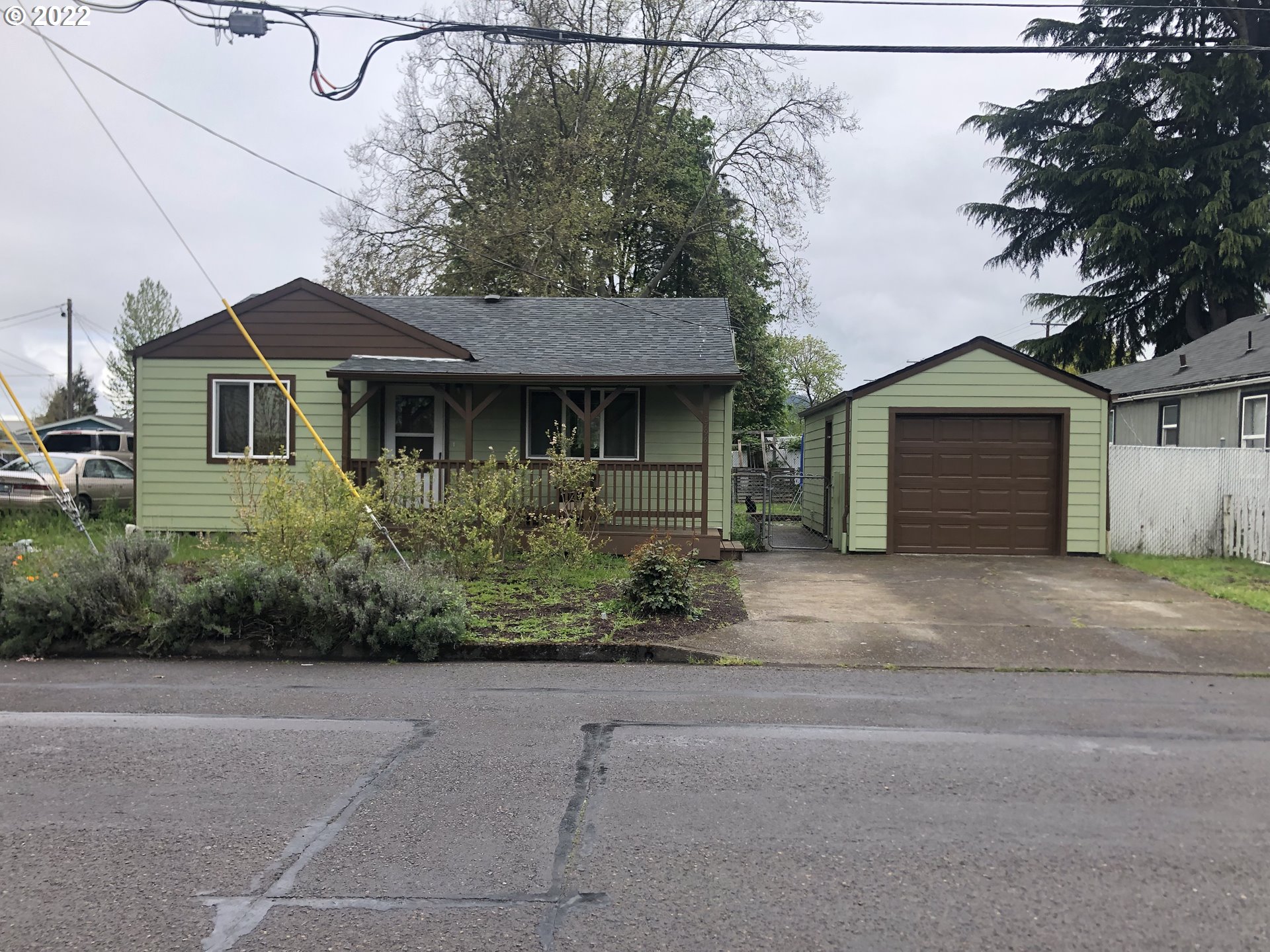 2796 J Street Springfield, OR 97477 - Photo 1 of 18 a front view of a house with a yard and garage