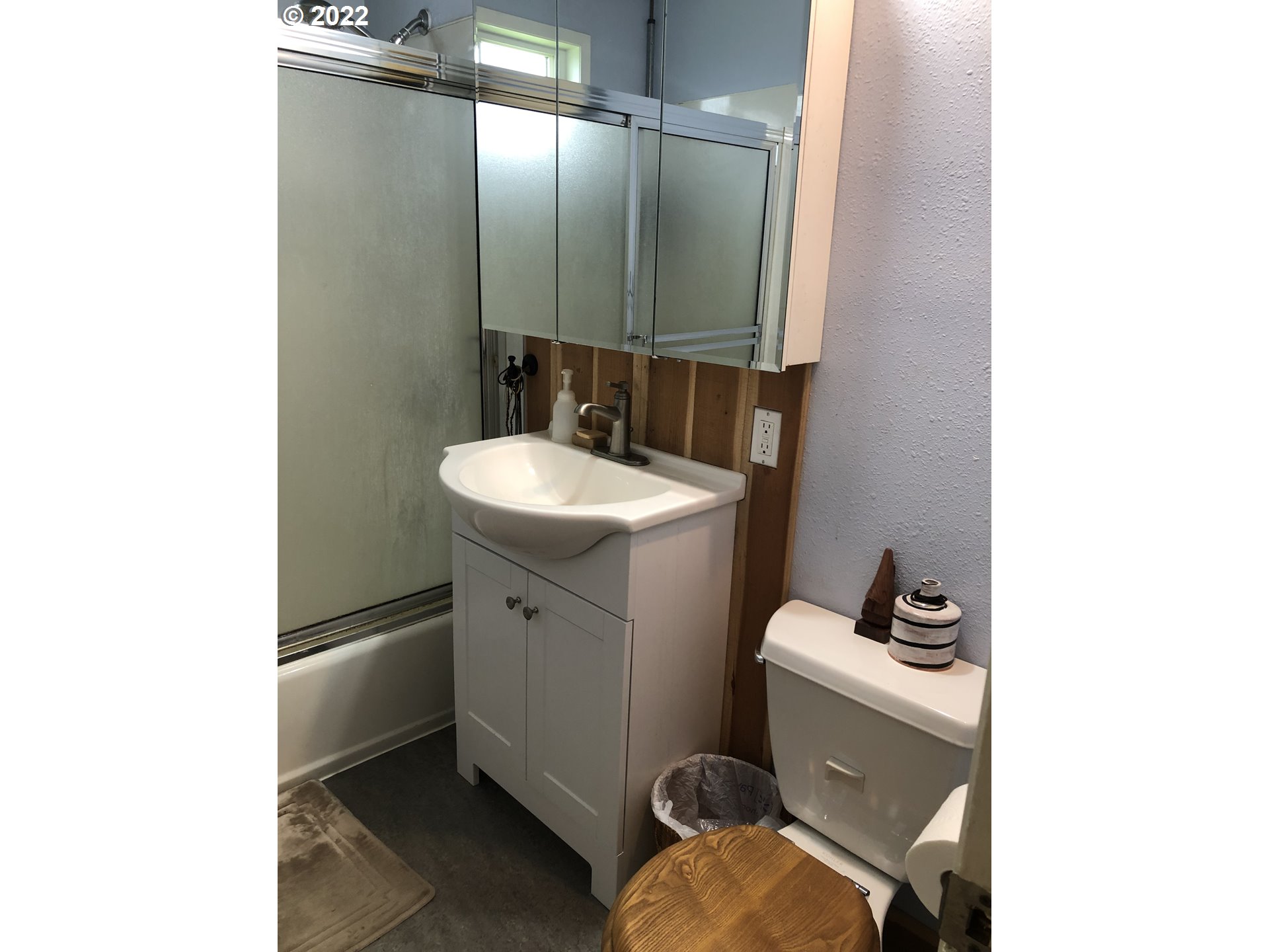2796 J Street Springfield, OR 97477 - Photo 12 of 18 a bathroom with a sink toilet and mirror