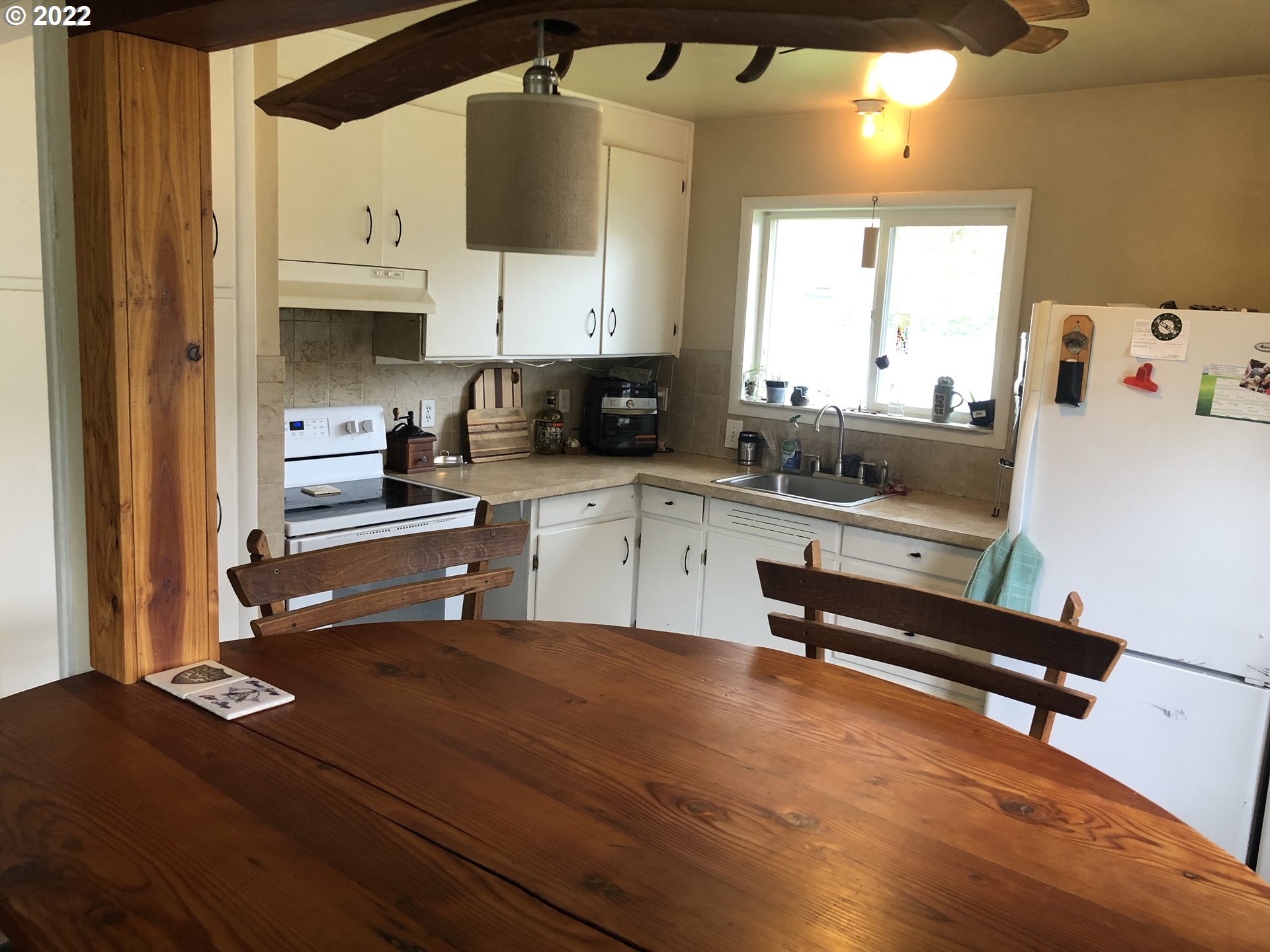 2796 J Street Springfield, OR 97477 - Photo 4 of 18 a kitchen with a sink a stove and cabinets