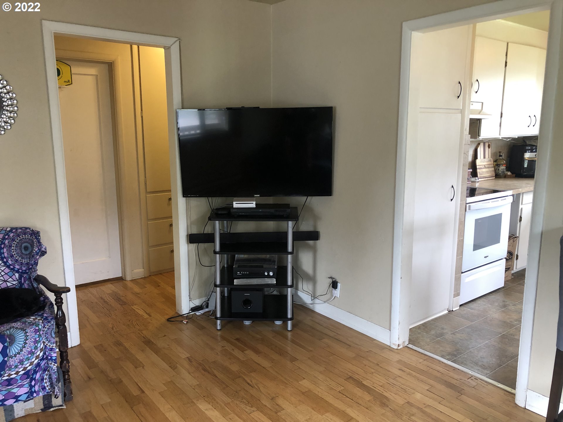 2796 J Street Springfield, OR 97477 - Photo 7 of 18 a view of kitchen with furniture flat screen tv and refrigerator