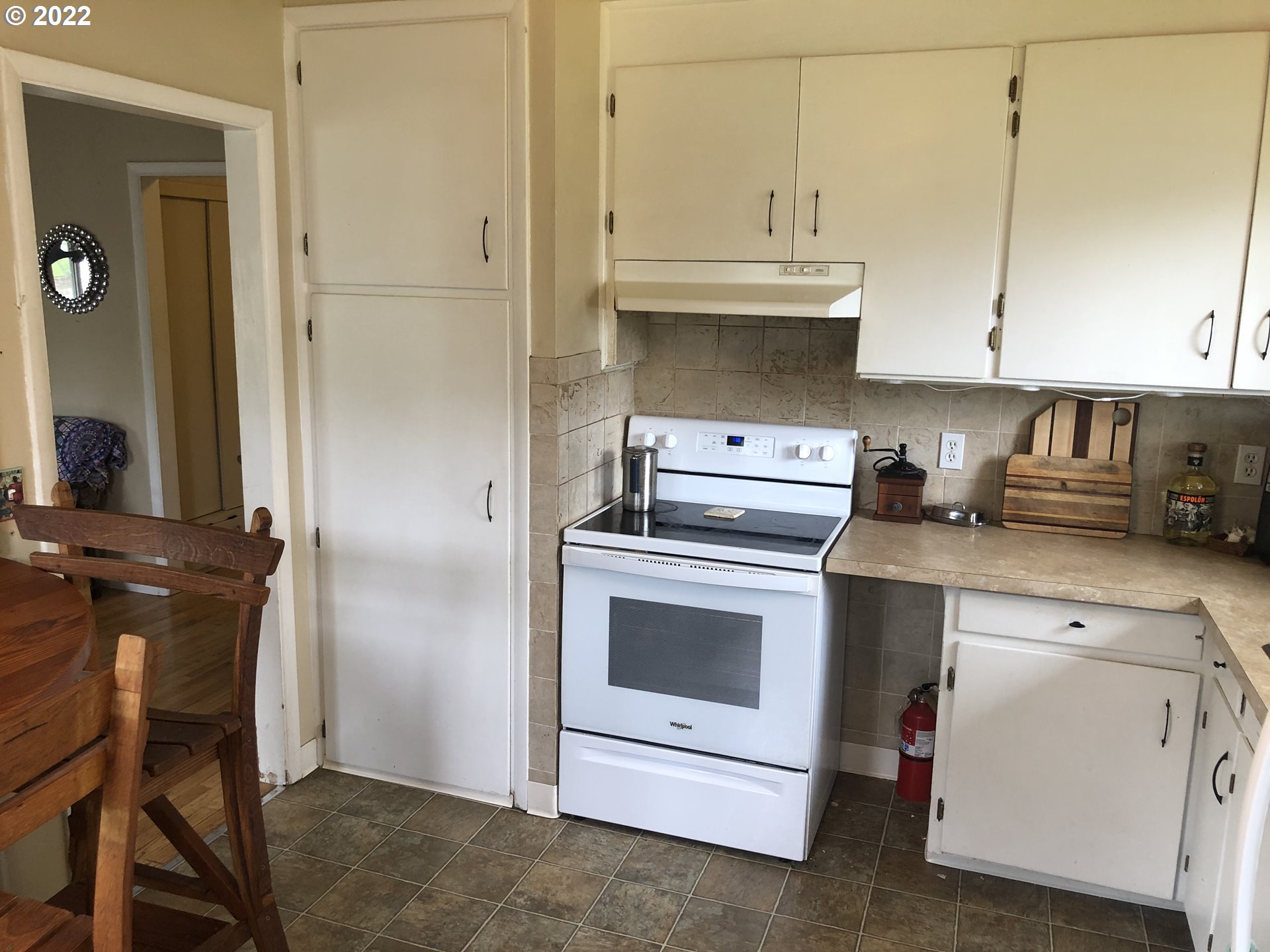 2796 J Street Springfield, OR 97477 - Photo 10 of 18 a kitchen with a stove and white cabinets