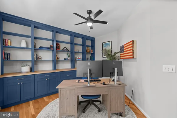 a bedroom with a bed and a chair