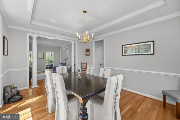 a large kitchen with a table and chairs