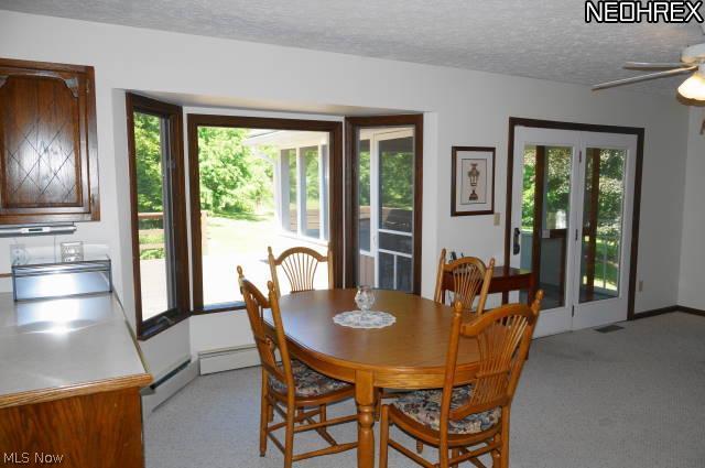 2700 Johnnycake Road Mogadore, OH 44260 - Photo 8 of 23 French doors lead to the screened in porch.