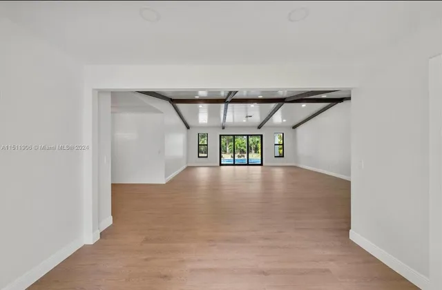 a view of a room with window and wooden floor