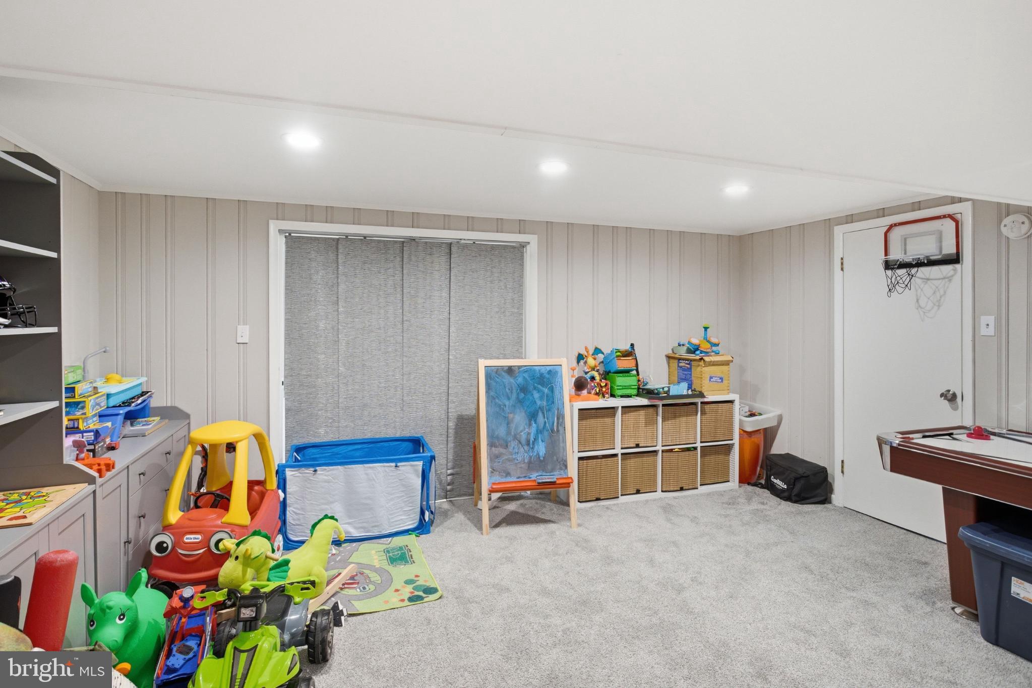 8802 Parliament Drive Springfield, VA 22151 - Photo 33 of 47 Bright and playful children's playroom space.