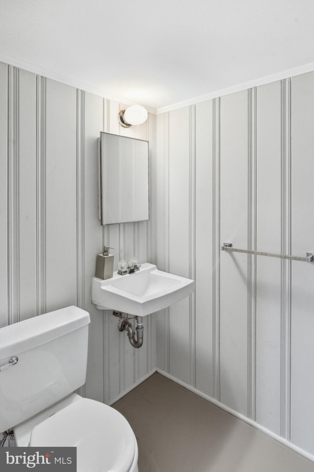 8802 Parliament Drive Springfield, VA 22151 - Photo 37 of 47 Chic half-bath with modern stripes.