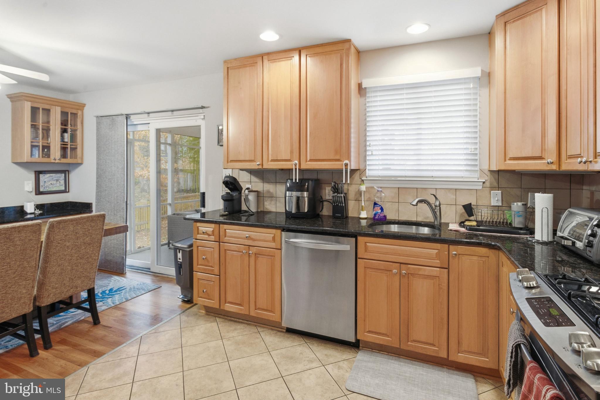 8802 Parliament Drive Springfield, VA 22151 - Photo 10 of 47 Modern kitchen with warm wood accents.