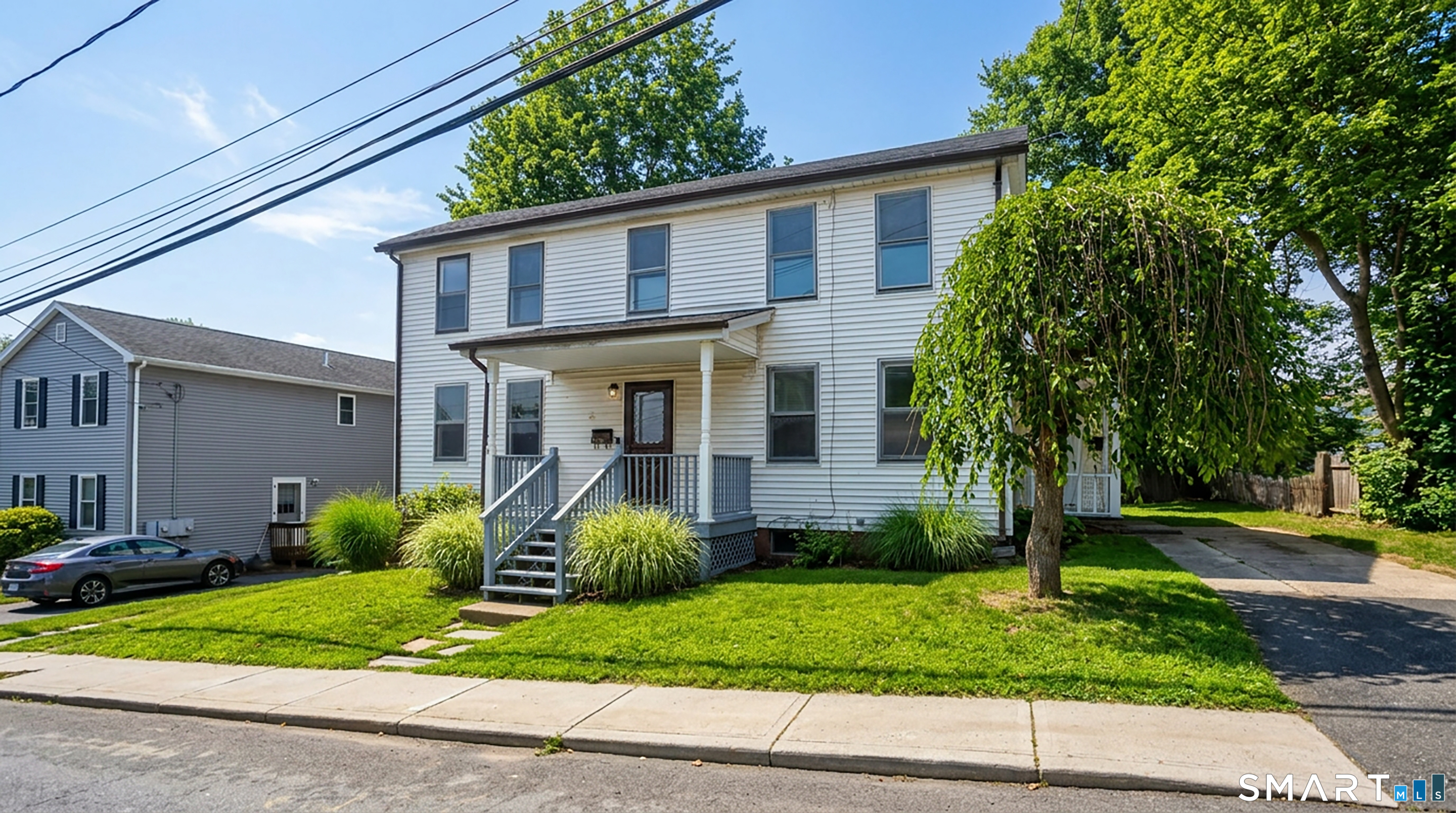 a view of a house with a yard and plants