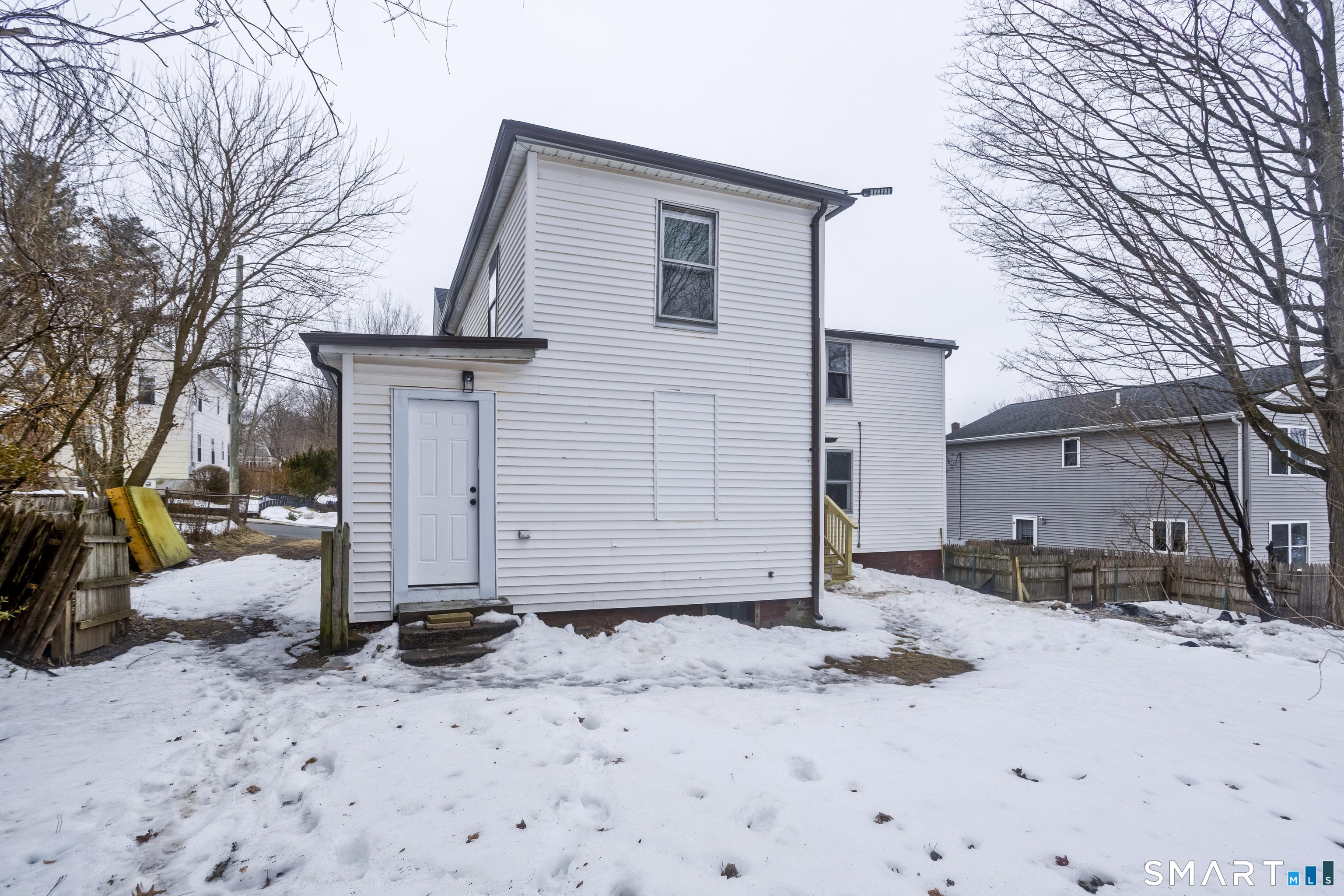 47 Maple Avenue Enfield, CT 06082 - Photo 2 of 36 a view of a house with a snow in the yard