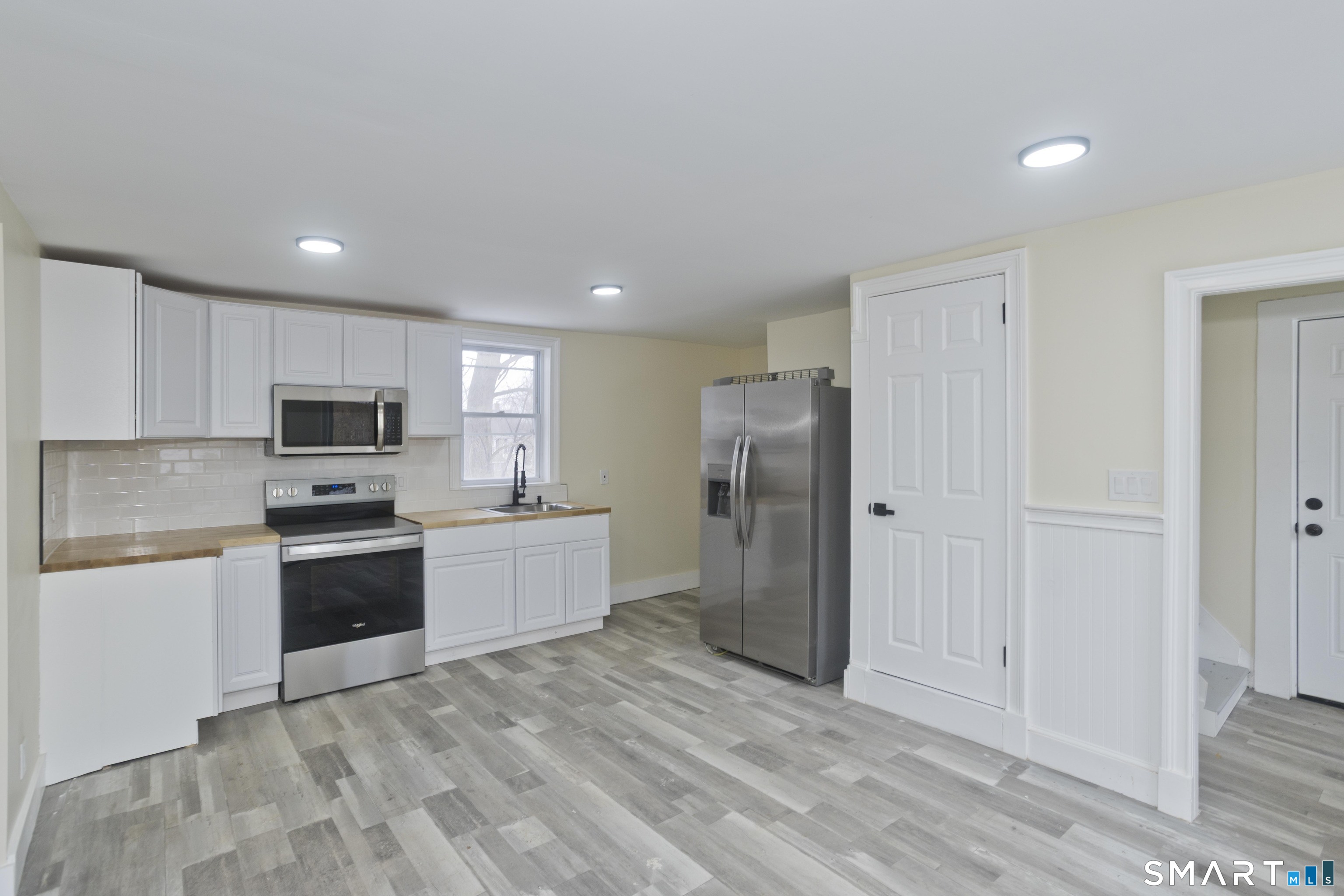 47 Maple Avenue Enfield, CT 06082 - Photo 24 of 36 a large kitchen with cabinets stainless steel appliances and a counter space