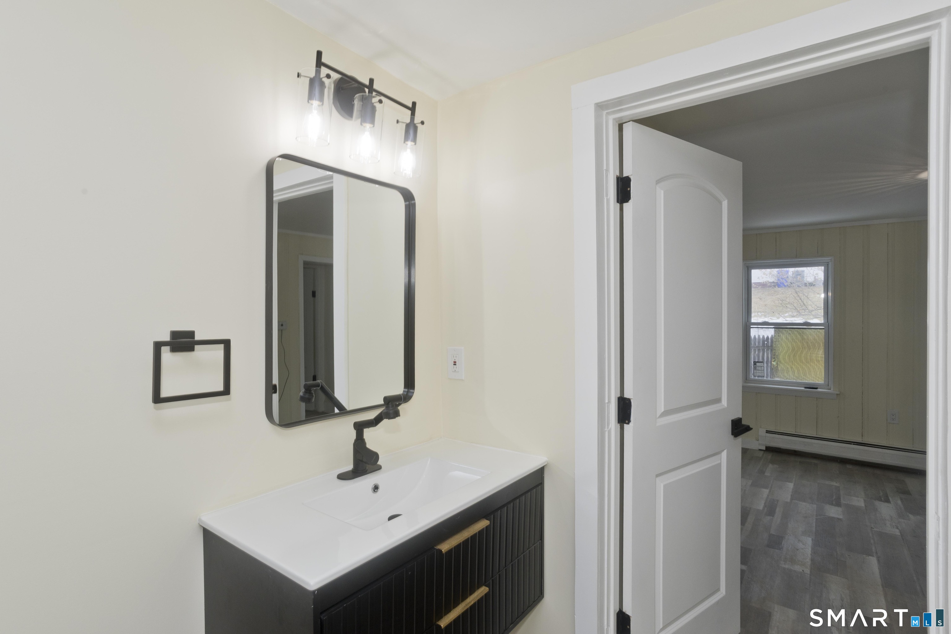 47 Maple Avenue Enfield, CT 06082 - Photo 27 of 37 a bathroom with a sink and a mirror