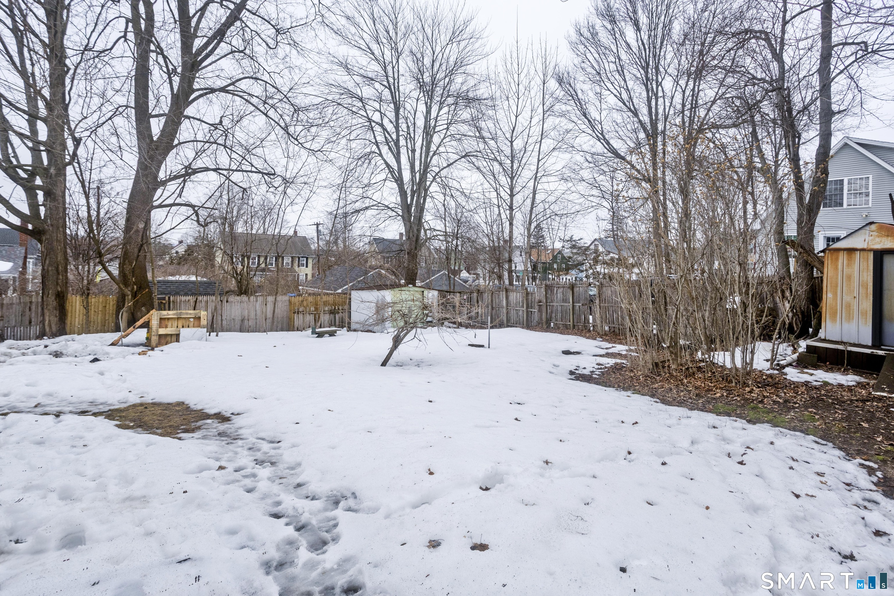 47 Maple Avenue Enfield, CT 06082 - Photo 4 of 37 a view of snow on the road