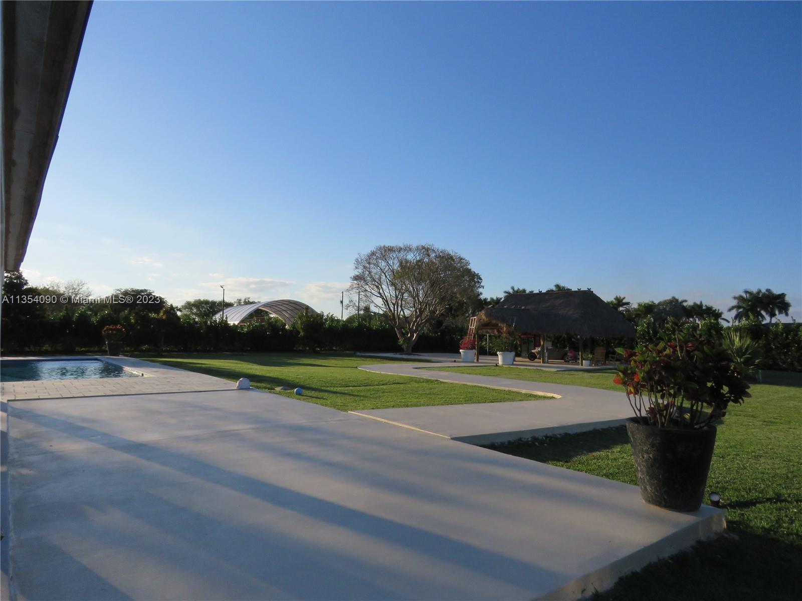 Redlands Homestead, FL 33031 - Photo 11 of 56 a view of a golf course with a lake