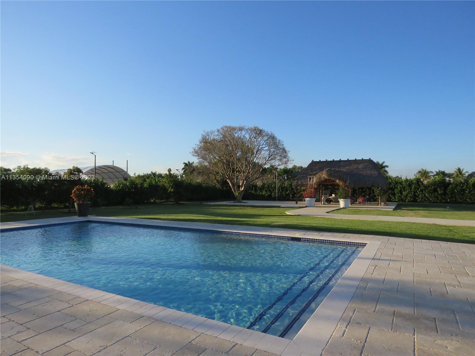 Redlands Homestead, FL 33031 - Photo 13 of 56 a view of swimming pool with outdoor space and seating area