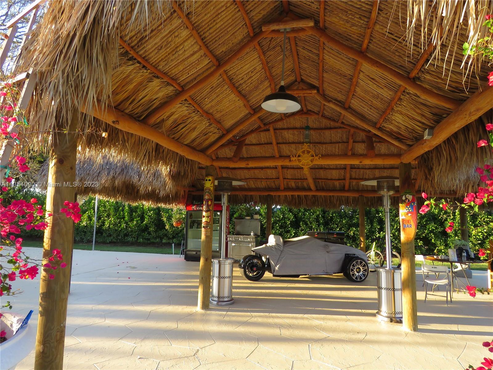 Redlands Homestead, FL 33031 - Photo 20 of 56 a view of a patio with a table and chairs and potted plants
