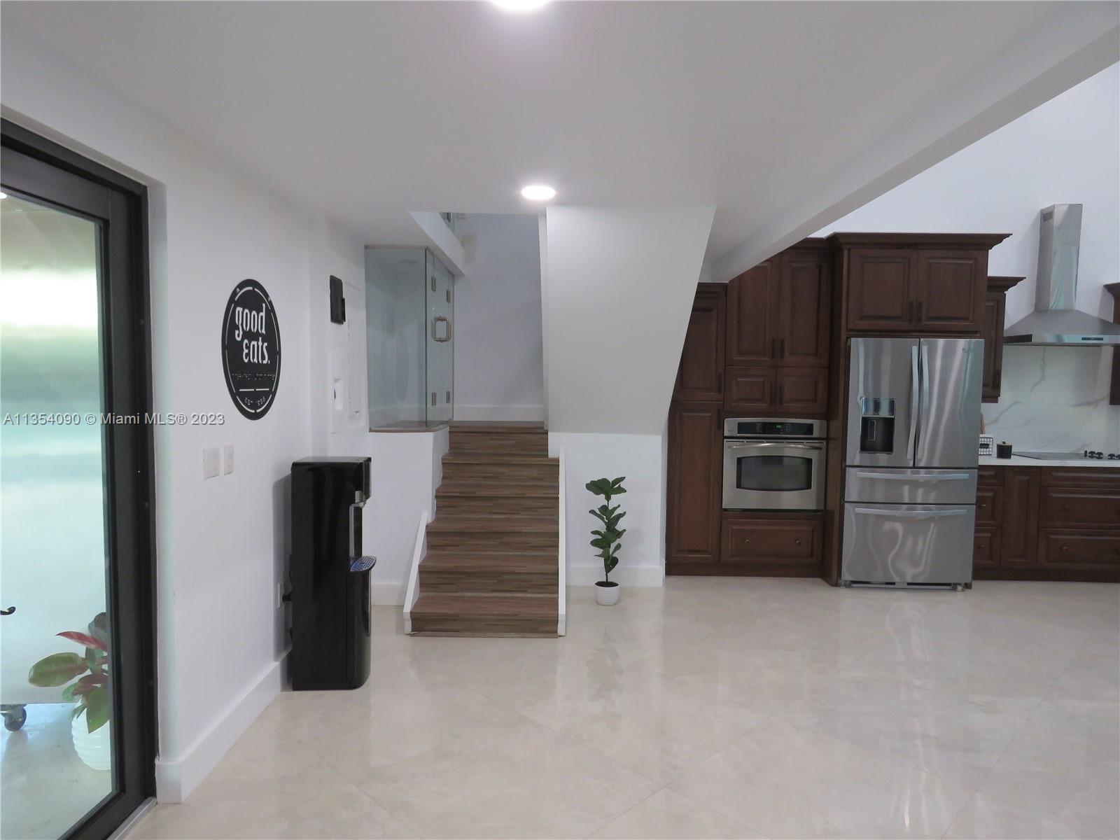 Redlands Homestead, FL 33031 - Photo 25 of 56 a kitchen with a refrigerator and a refrigerator