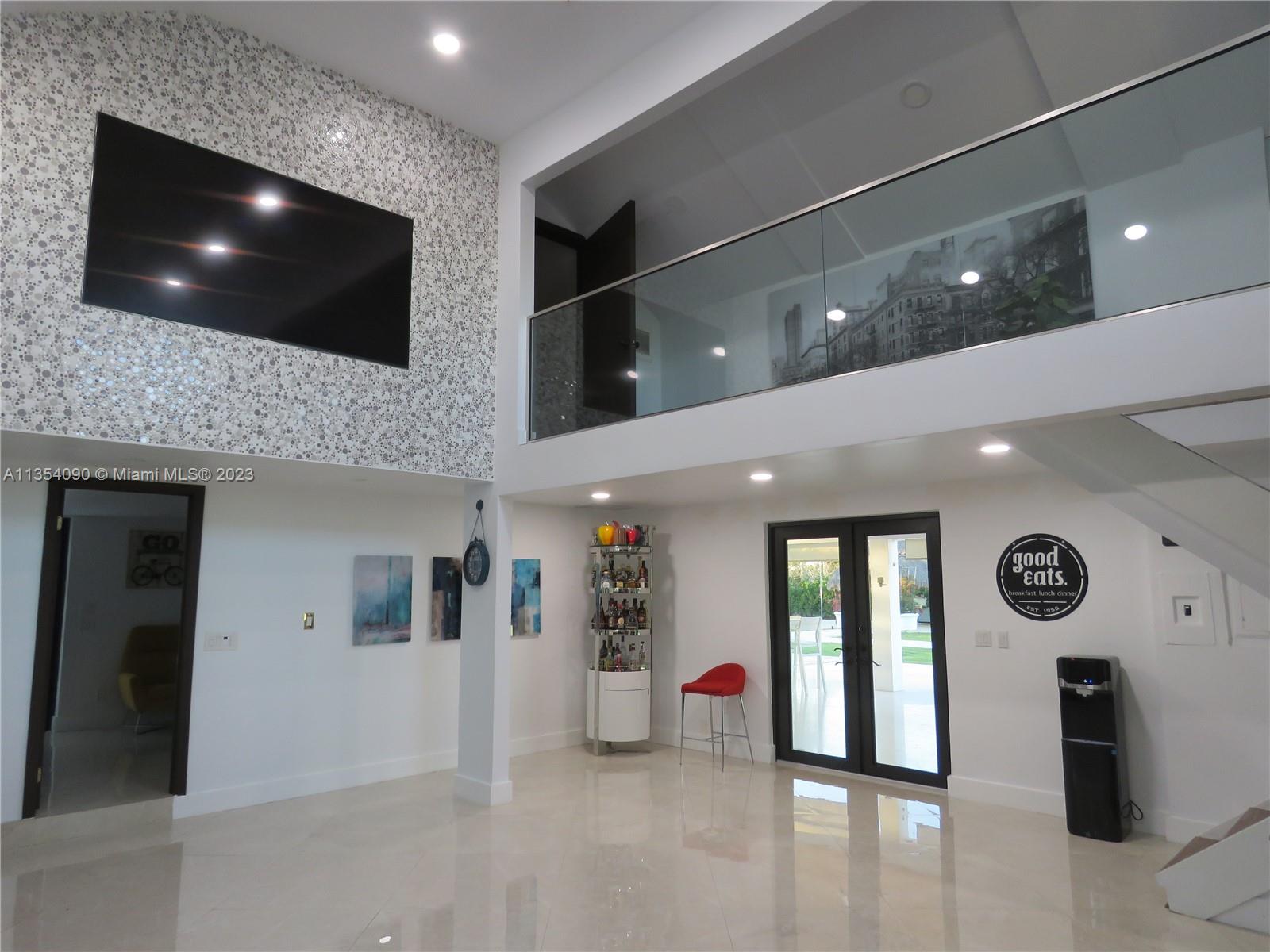 Redlands Homestead, FL 33031 - Photo 27 of 56 a living room with furniture and a flat screen tv