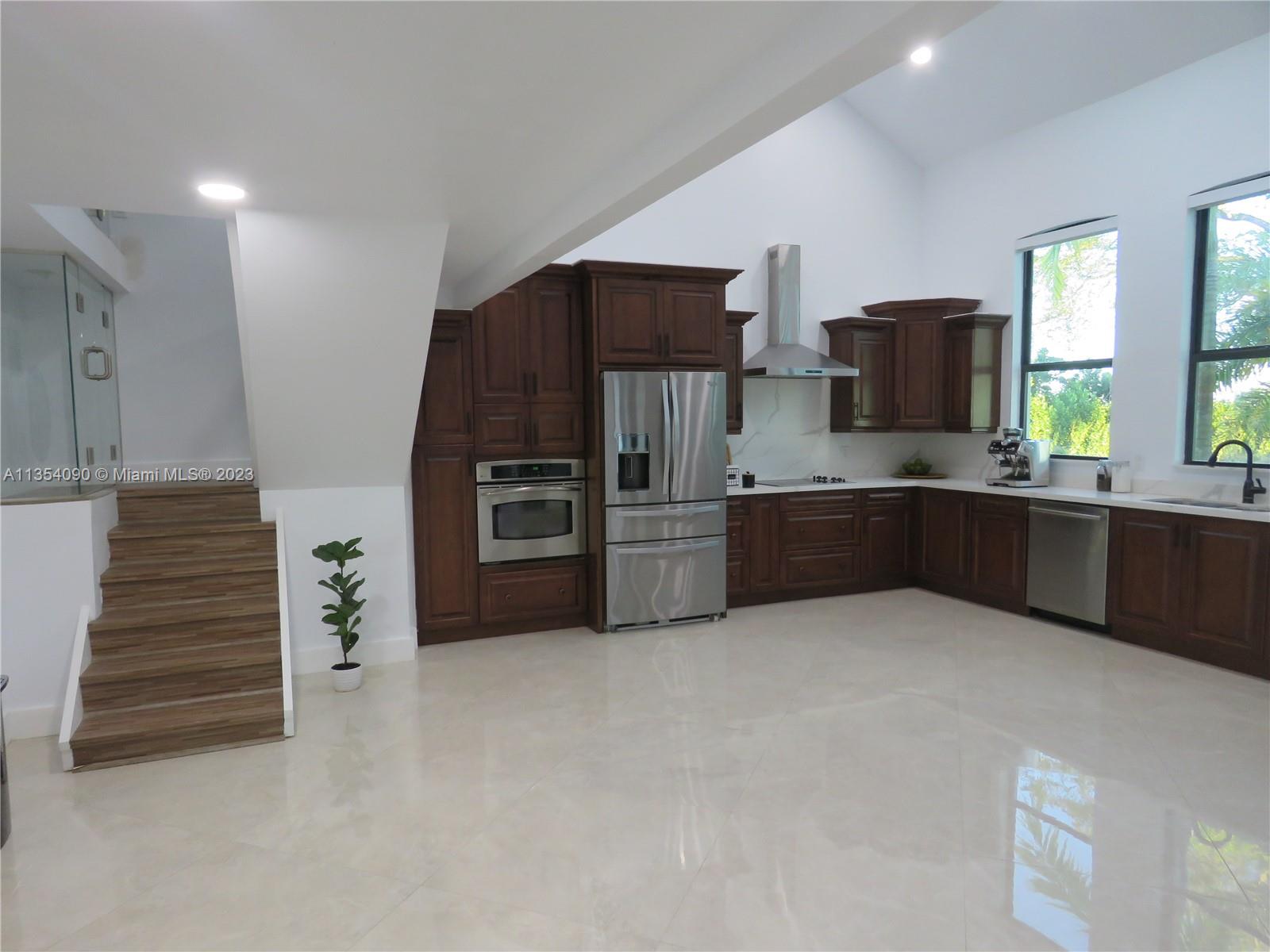 Redlands Homestead, FL 33031 - Photo 28 of 56 a kitchen with stainless steel appliances a refrigerator and a sink